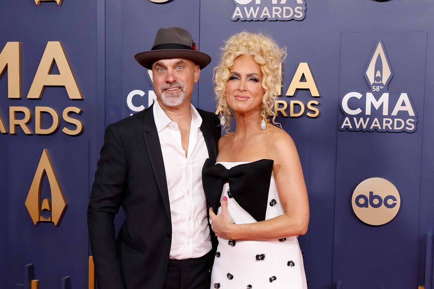 Stephen Schlapman and Kimberly Schlapman pose together in black and white outfits.