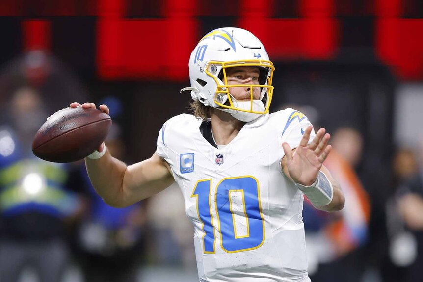 Justin Herbert #10 of the Los Angeles Chargers throws the ball during a game.