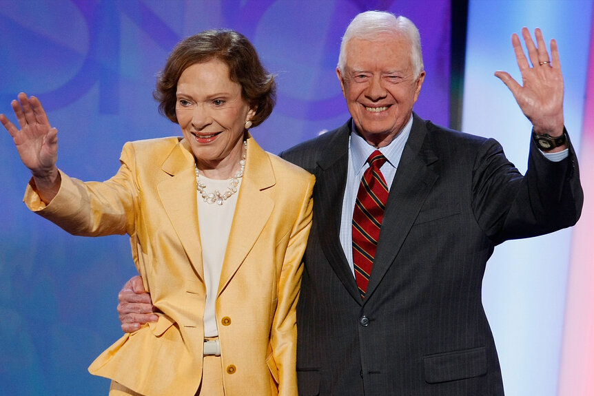 President Jimmy Carter and first lady Rosalynn Carter wave together.