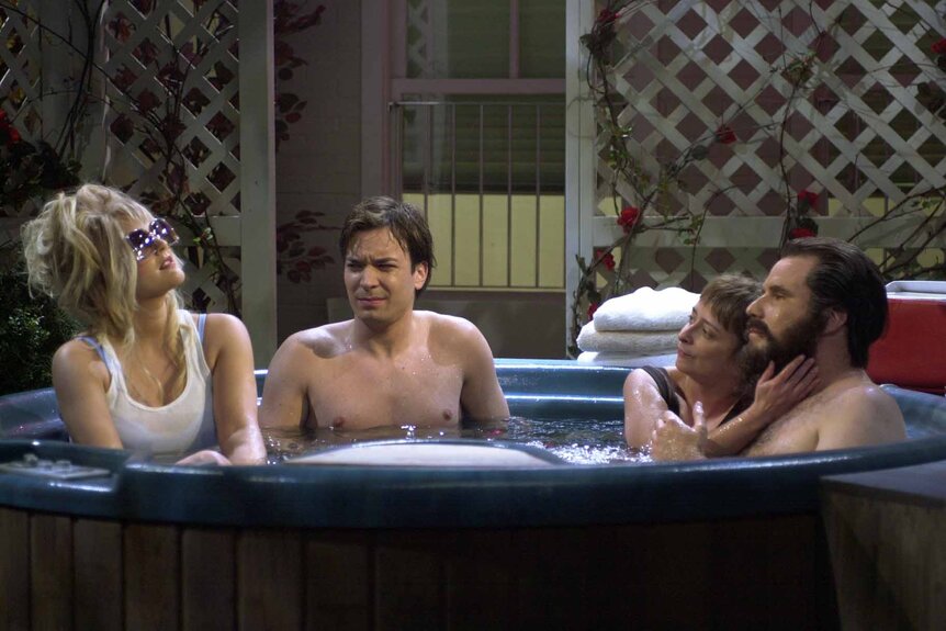 Barbara Hernandez (Drew Barrymore), Dave (Jimmy Fallon), Virginia Klarvin (Rachel Dratch), and Roger Klarvin (Will Ferrell) sit in a hot tub on SNL.