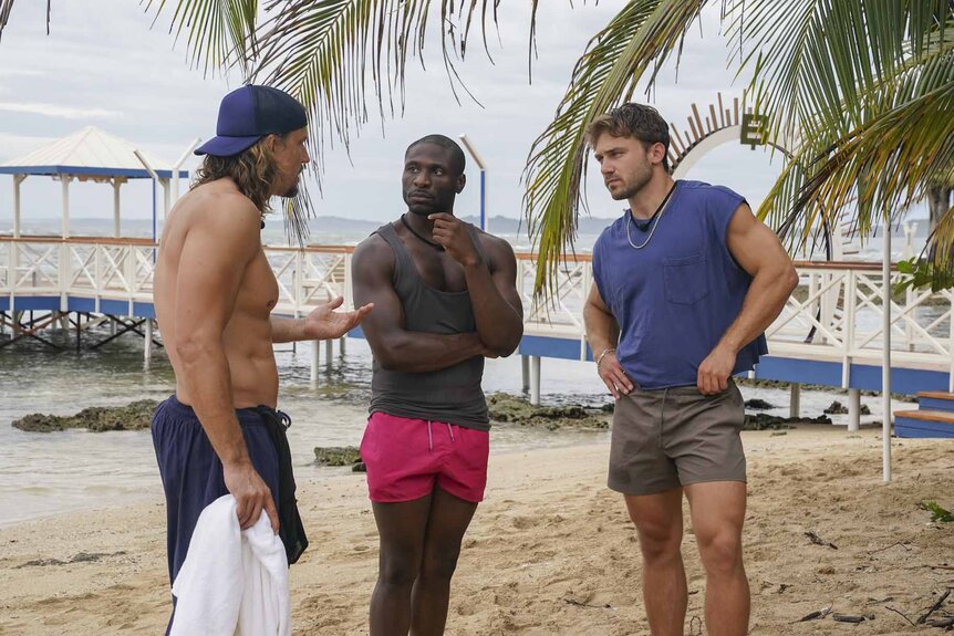 David Genat, Phillip Soloman, and Storm Wilson chat on the beach on Deal or No Deal Island Episode 201.