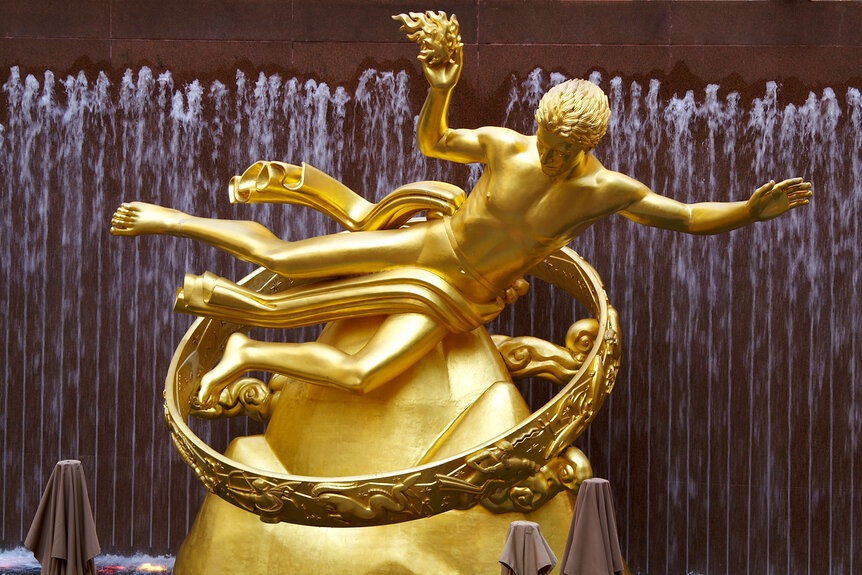 A view of the Statue Of Prometheus at Rockefeller Plaza in front of a water fountain