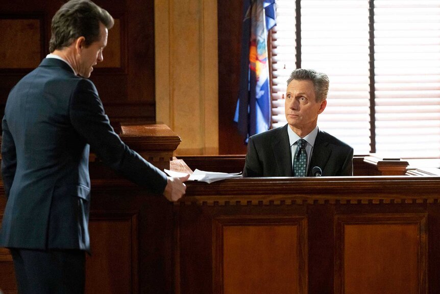 Nolan Price and Nicholas Baxter having a conversation on Law & Order Season 24 Episode 9.