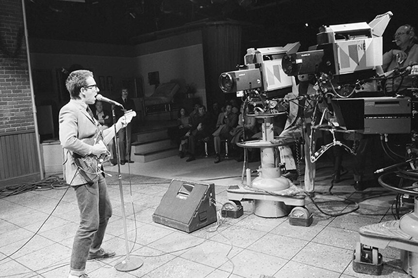 Elvis Costello performing on stage during Saturday Night Live Season 3, Episode 8.