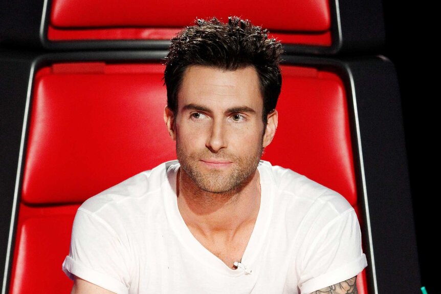 Adam Levine wears a white t-shirt in his coaches chair on The Voice Season 4 Episode 3