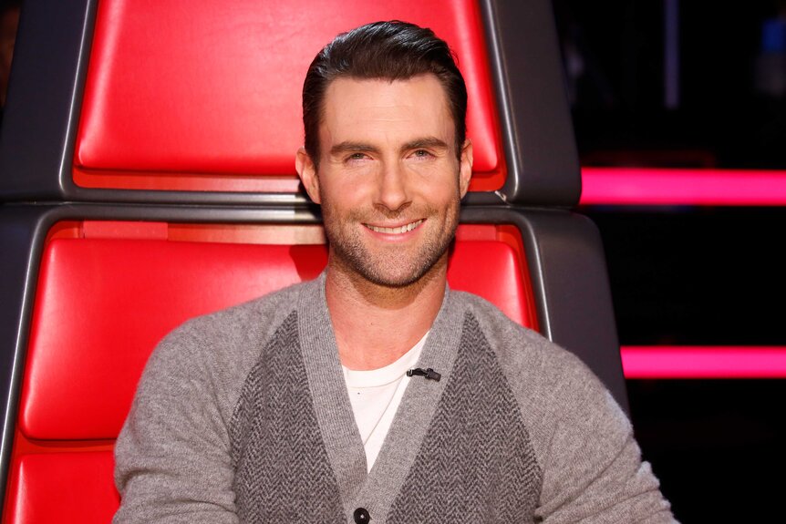 Adam Levine wears a grey sweater on the coaches chair on The Voice Season 5, Episode 14A.