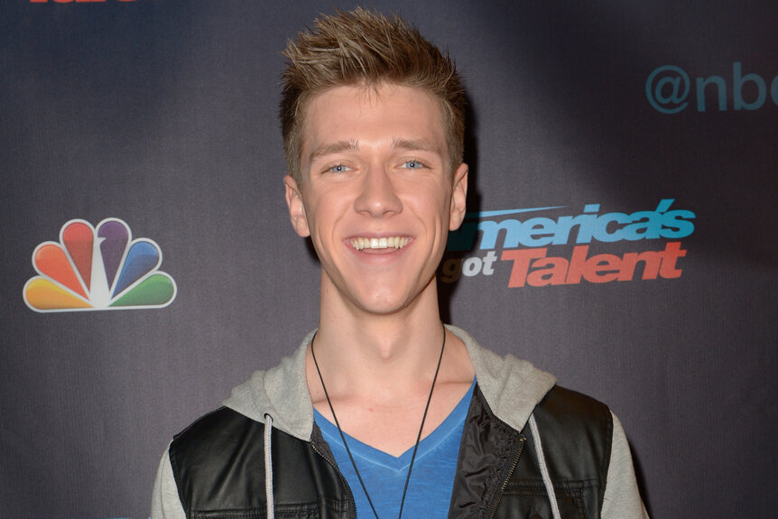 Collins Key smiles on the red carpet of Americas Got Talent Season 8 Episode 26