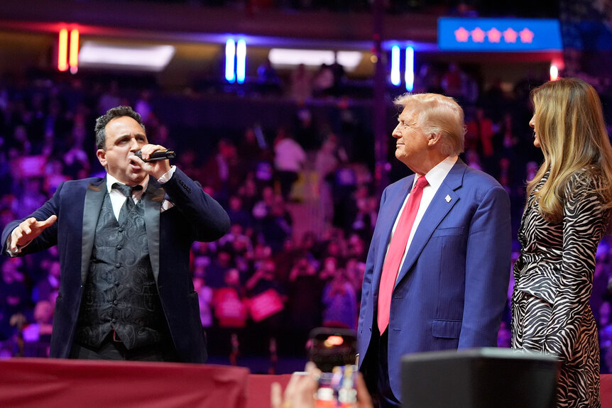 Christopher Macchio performs for Donald Trump and Melania Trump during a rally