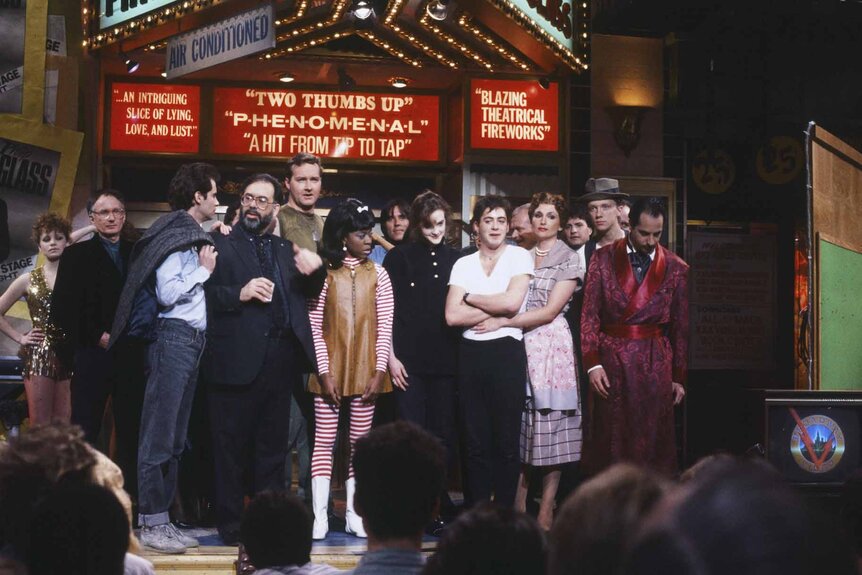 The cast of Saturday Night Live Episode 1113 stands onstage together.