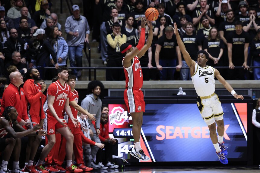 Myles Colvin #5 of the Purdue Boilermakers blocks a ball during a game.