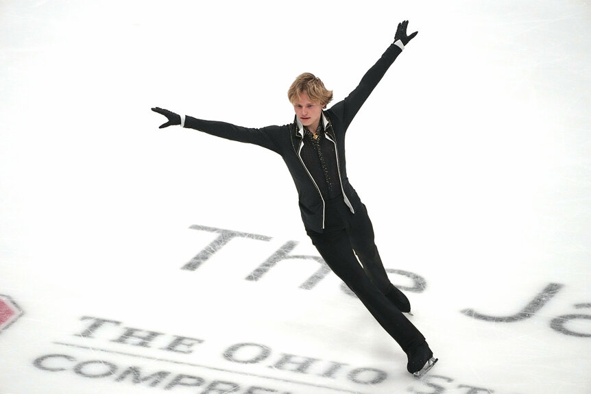 Ilia Malinin performing a figure skating routine.