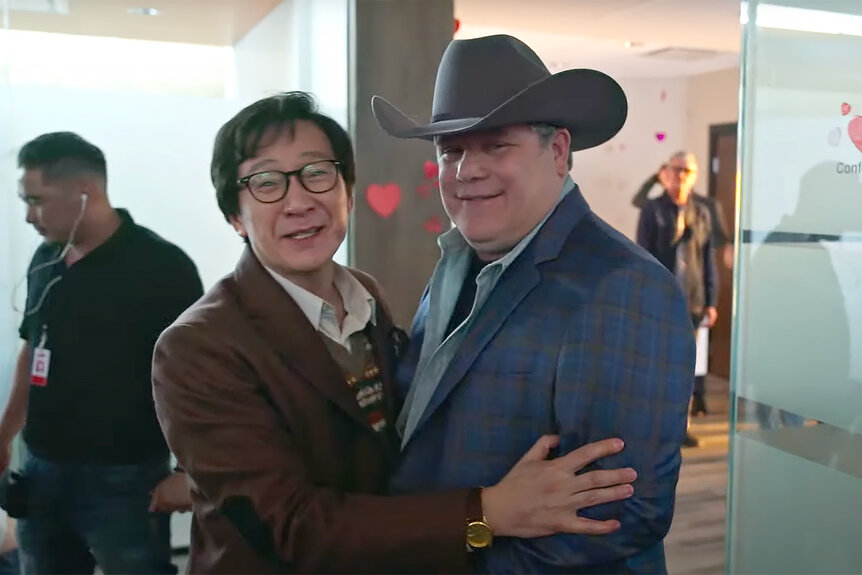 Ke Huy Quan and Sean Astin embrace on a behind the scenes video of Love Hurts