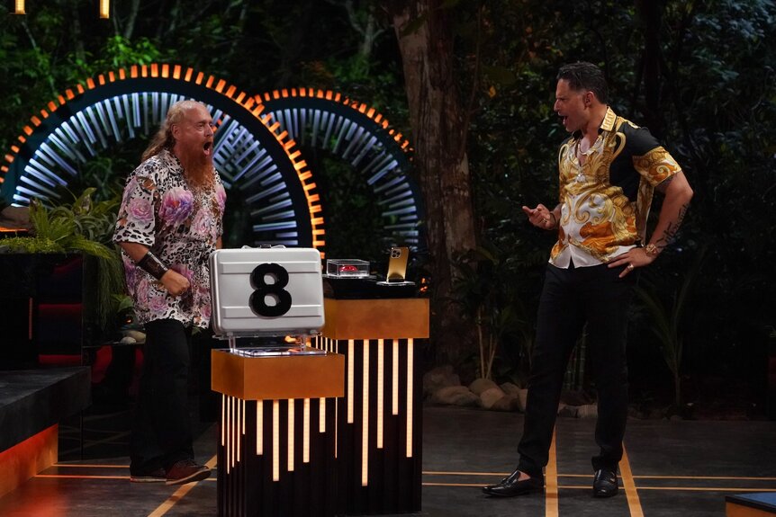 Charles Carlson and Joe Manganiello celebrate together on Deal or No Deal Island Episode 203.