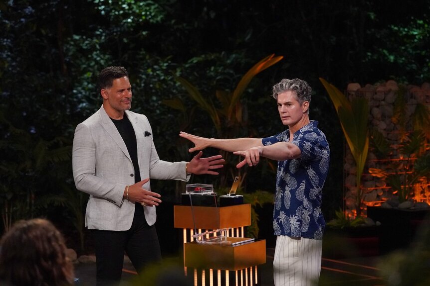 Joe Manganiello watches "Dr. Will" Kirby point fingers on Deal or No Deal Island Episode 204.