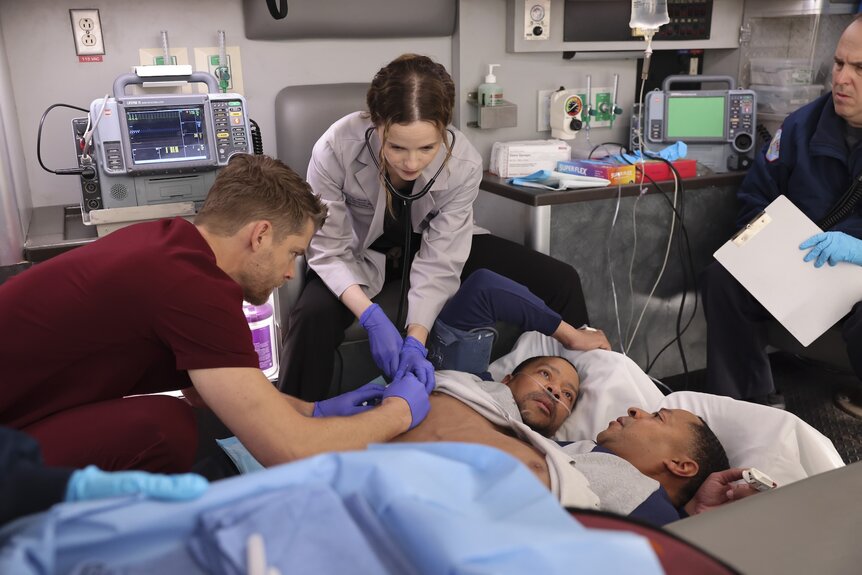 A doctor uses a stethoscope on conjoined twins (Jason and Victor Turner) on Chicago Med Episode 1010.