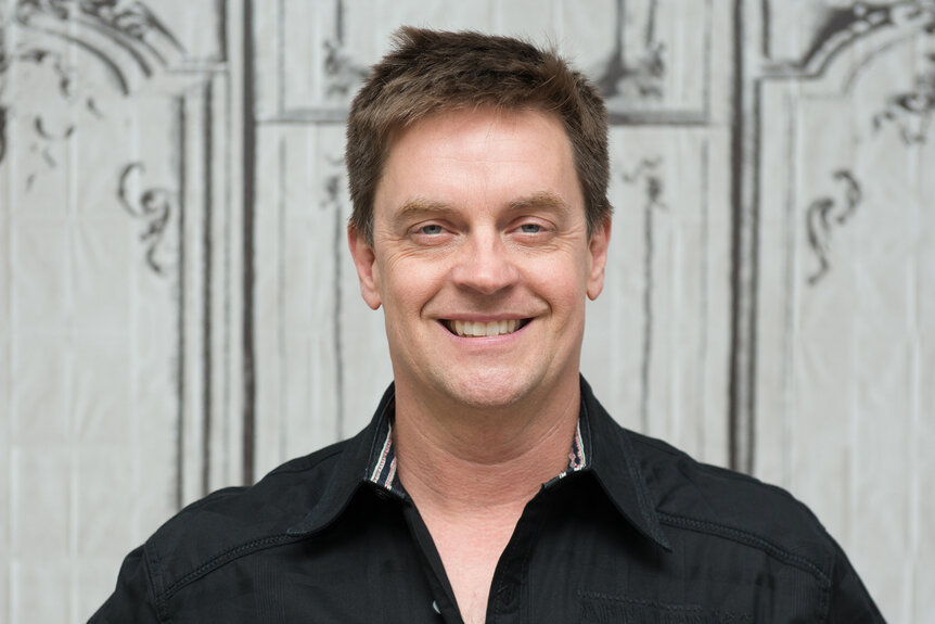 Jim Breuer smiles in a black shirt