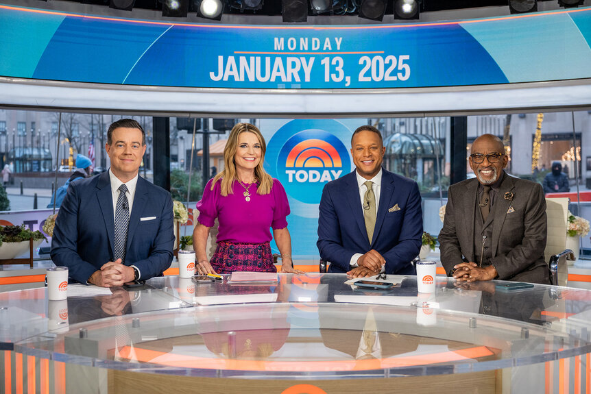 The Today Show Anchors sit at the news desk and smile together