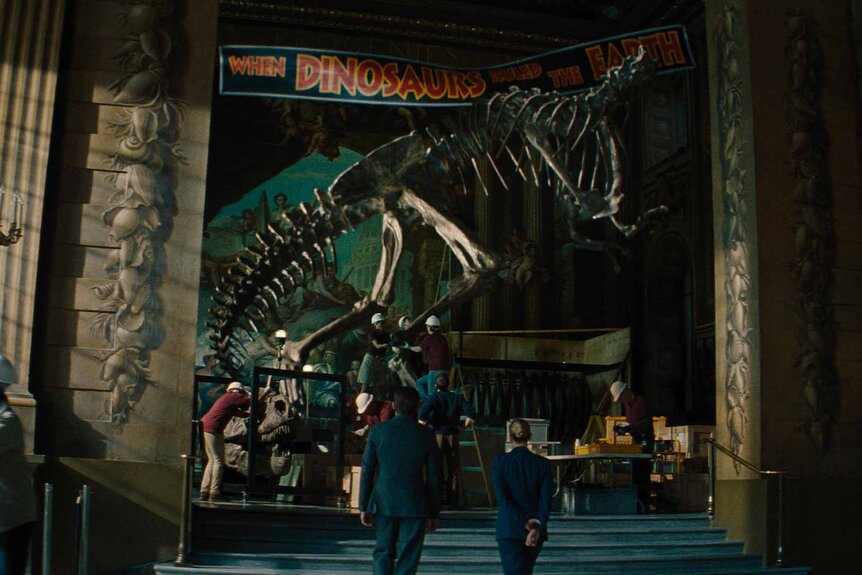 A dinosaur skeleton is on display in a musuem in Jurassic World Rebirth (2025).