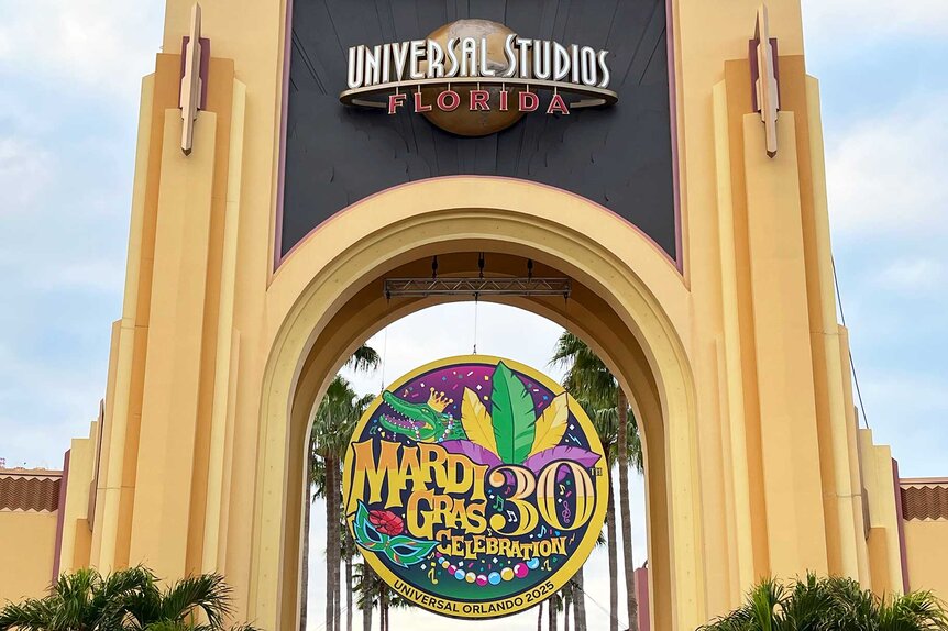 Outside entrance of the Universal Orlando Resort's with Mardi Gras Celebration logo.