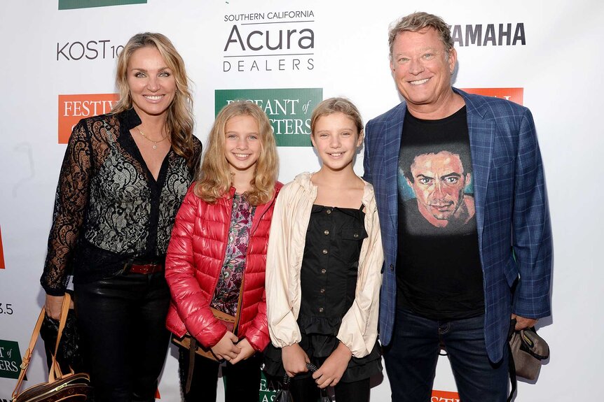 Chris Rich with wife Eva Halina Rich and daughters Daisy Wilson and Lily Wilson posing together at the Festival of Arts Celebrity Benefit Concert and Pageant.