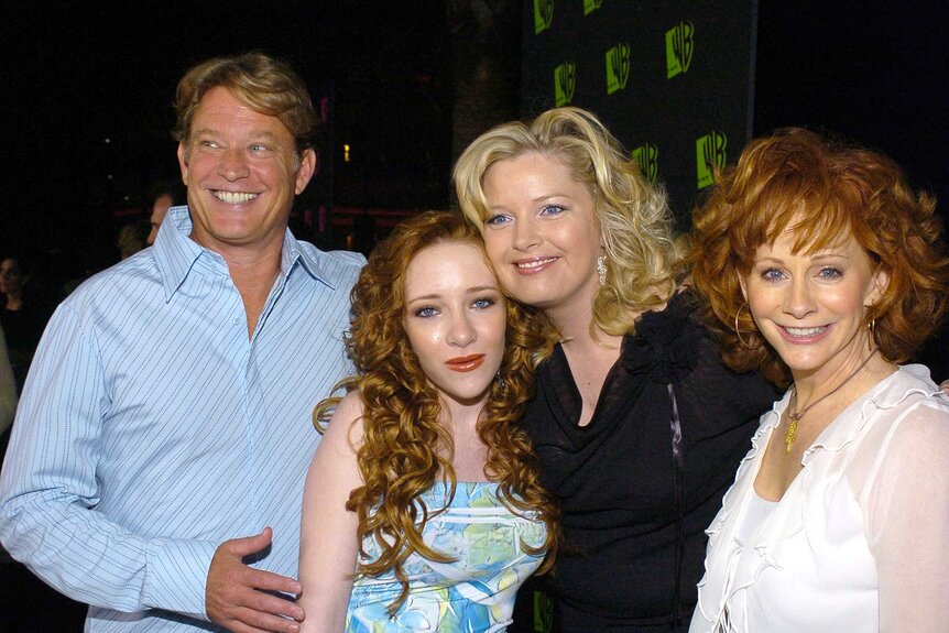 Chris Rich, Scarlett Pomers, Melissa Peterman, and Reba McEntire posing at The 2004 All Star Party Red Carpet and Party.