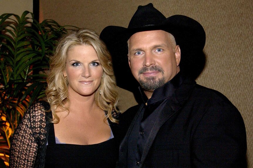 Trisha Yearwood and husband Garth Brooks smiling together at the 35th Annual Songwriters Hall of Fame Awards.