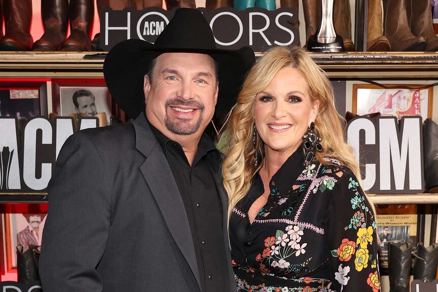 Garth Brooks and wife Trisha Yearwood smiling at the 17th Academy Of Country Music Honors.