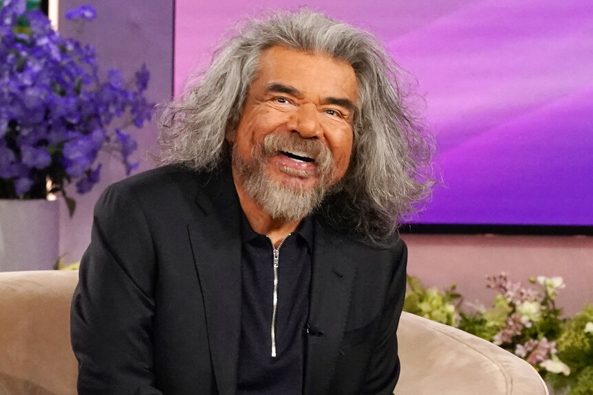 George Lopez smiles with long hair on the Jennifer Hudson Show