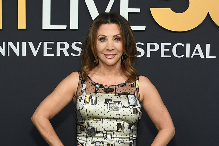 Cheri Oteri poses in a patterned sequin dress on the SNL50 red carpet.