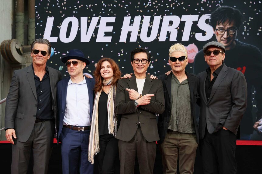 Josh Brolin, Jeff Cohen, Kerri Green, Ke Huy Quan, Corey Feldman and Chris Columbus posing together Ke Huy Quan's hand and footprint cement ceremony.