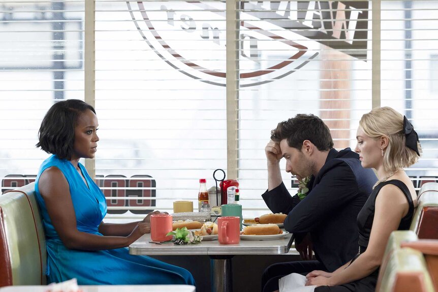 Catherine, Brett, and Alice sitting at a restaurant table in Grosse Pointe Garden Society Season 1, Episode 2.