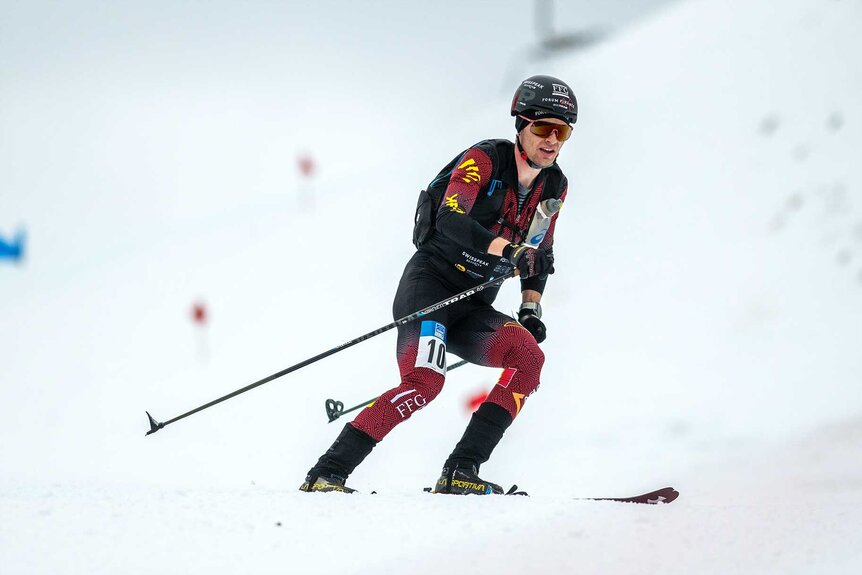 Maximilien Drion skiiing on top of snow during the ISMF Ski Mountaineering World Cup.