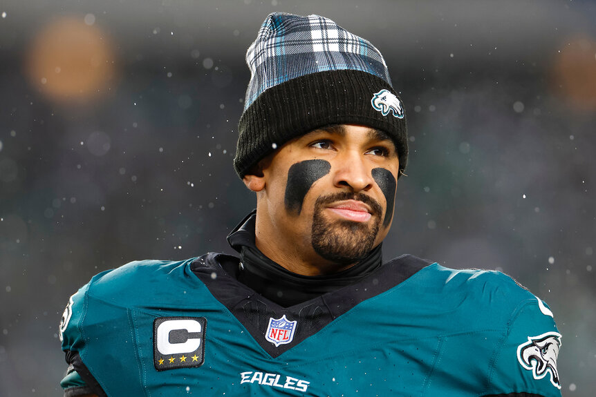 Jalen Hurts wears a beanie on the field during the NFC Divisional Playoff game