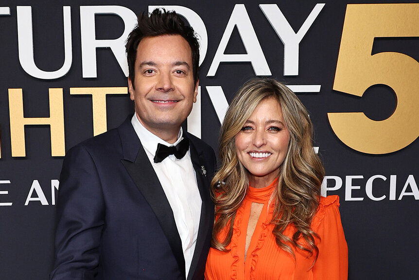 Jimmy Fallon and Nancy Juvonen smile together on the red carpt for SNL50