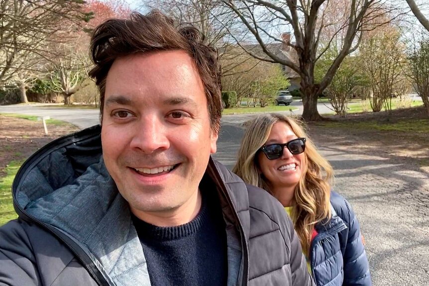 Jimmy Fallon and wife Nancy Juvonen outside together on The Tonight Show Starring Jimmy Fallon Season 7, Episode 135.