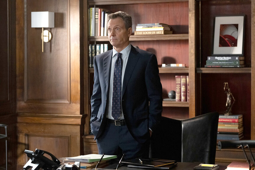 Nicholas Baxter stands in his office on Law And Order Season 24 Episode 14