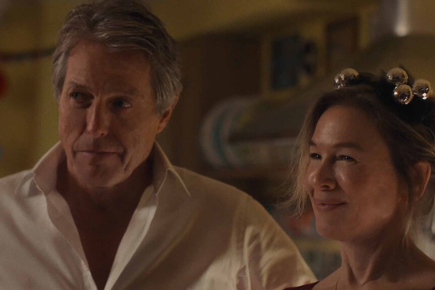 Daniel Cleaver (Hugh Grant) and Bridget Jones (Renée Zellweger) smile in Bridget Jones: Mad About the Boy (2025).