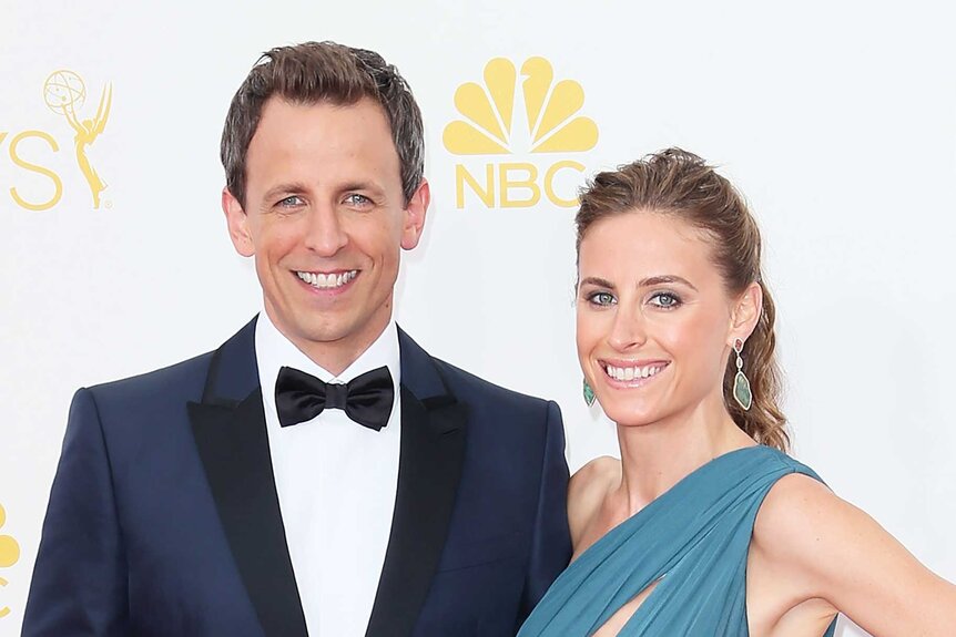 Seth Meyers and wife Alexi Ashe posing at the 66th Annual Primetime Emmy Awards.