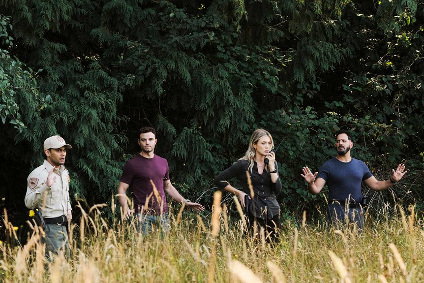 Ranger Dan, Shane Florence, Rebecca 'Bex' Henderson, and Jacob Hassani outside in The Hunting Party Season 1, Episode 3.