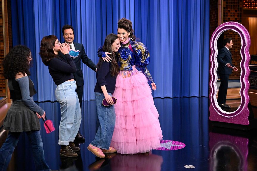 Jimmy Fallon with audience members on stage during The Tonight Show Starring Jimmy Fallon Season 12, Episode 73.