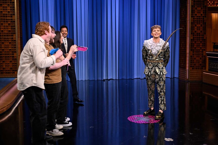 Jimmy Fallon with audience members on stage during The Tonight Show Starring Jimmy Fallon Season 12, Episode 74.