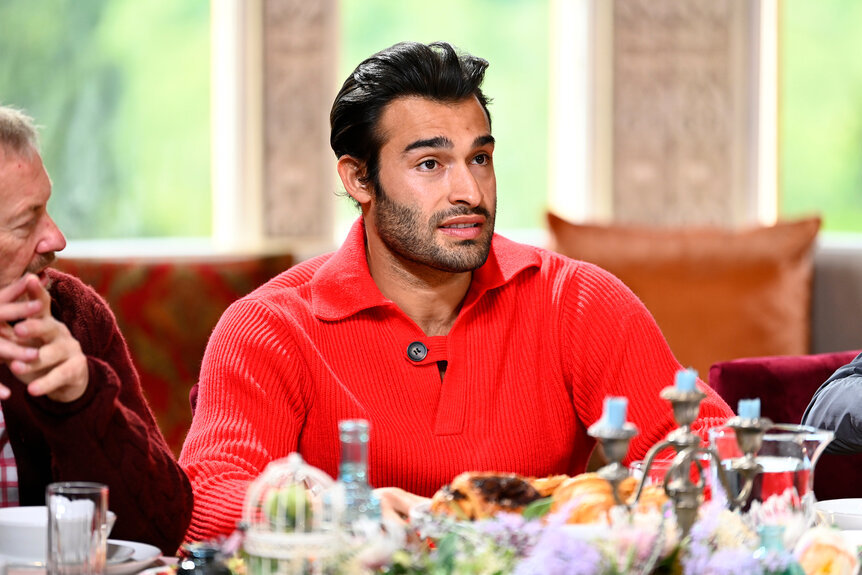 Sam Asghari sits at the breakfast table on The Traitors Season 3, Episode 8