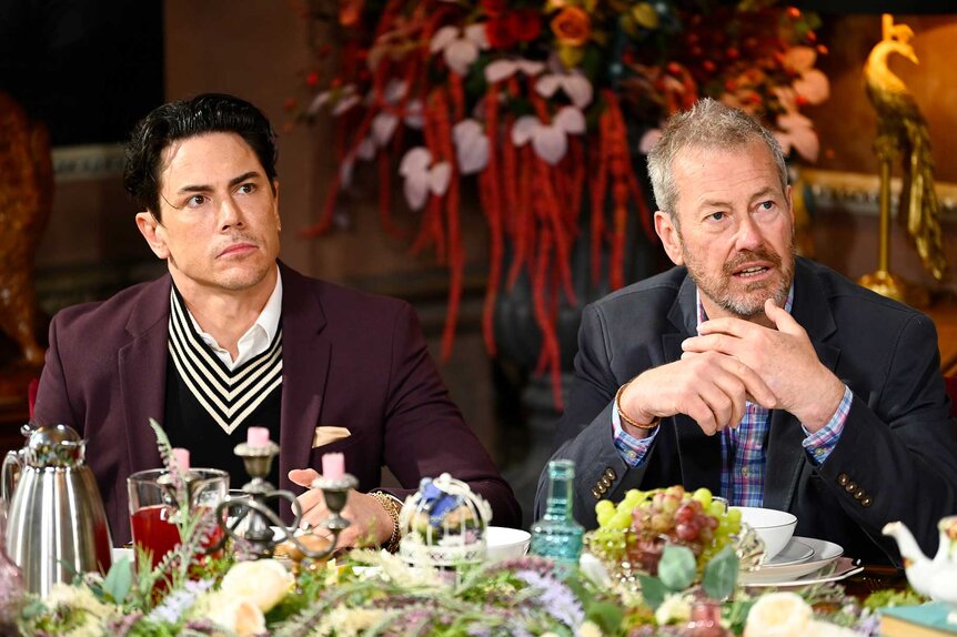 Tom Sandoval and Lord Ivar Mountbatten sitting at a table during The Traitors Season 3, Episode 9.