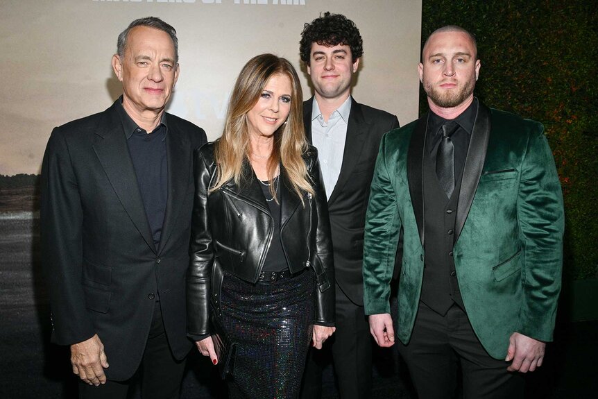 Tom Hanks, wife Rita Wilson, with children Truman Hanks and Chet Hanks posing at the premiere of Masters of the Air.