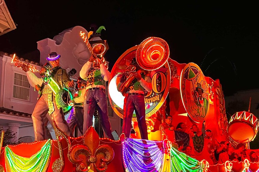 A marching band playing on top of a float during Universal Orlando Resort's Mardi Gras Celebration.