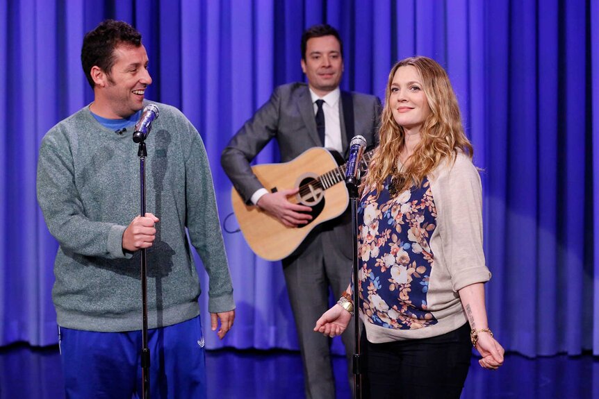 Adam Sandler and Drew Barrymore singing on stage with Jimmy Fallon during The Tonight Show Starring Jimmy Fallon Season 1, Episode 8.