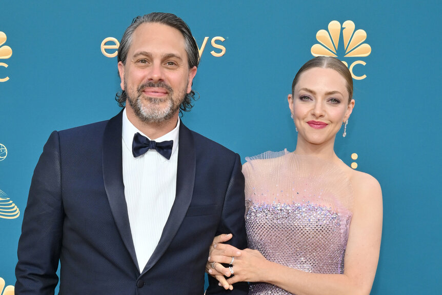 Amanda Seyfried and Thomas Sadoski smile together on the red carpet of the 2022 Emmy's