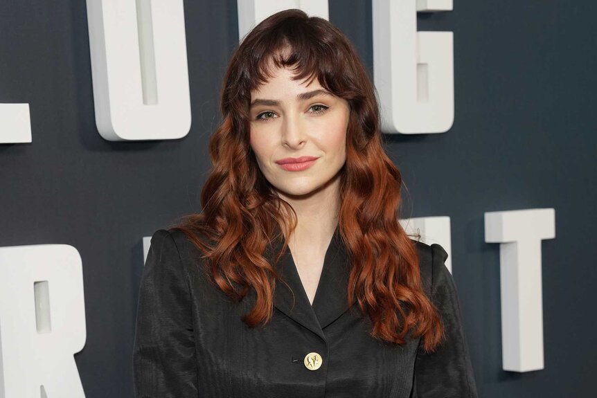 Ashleigh Cummings smiling and posing at the New York premiere of Long Bright River.