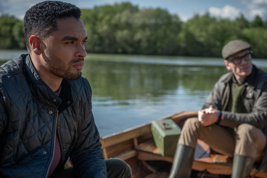 James Stokes and George Woodhouse sit in a row boat in Black Dog