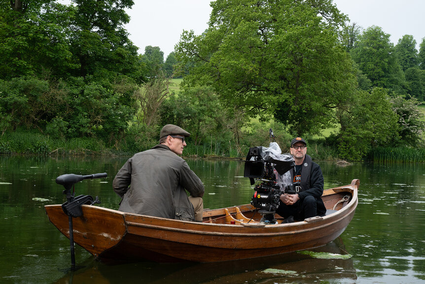 Michael Fassbender and Steven Soderbergh in a boat filming Black Dog